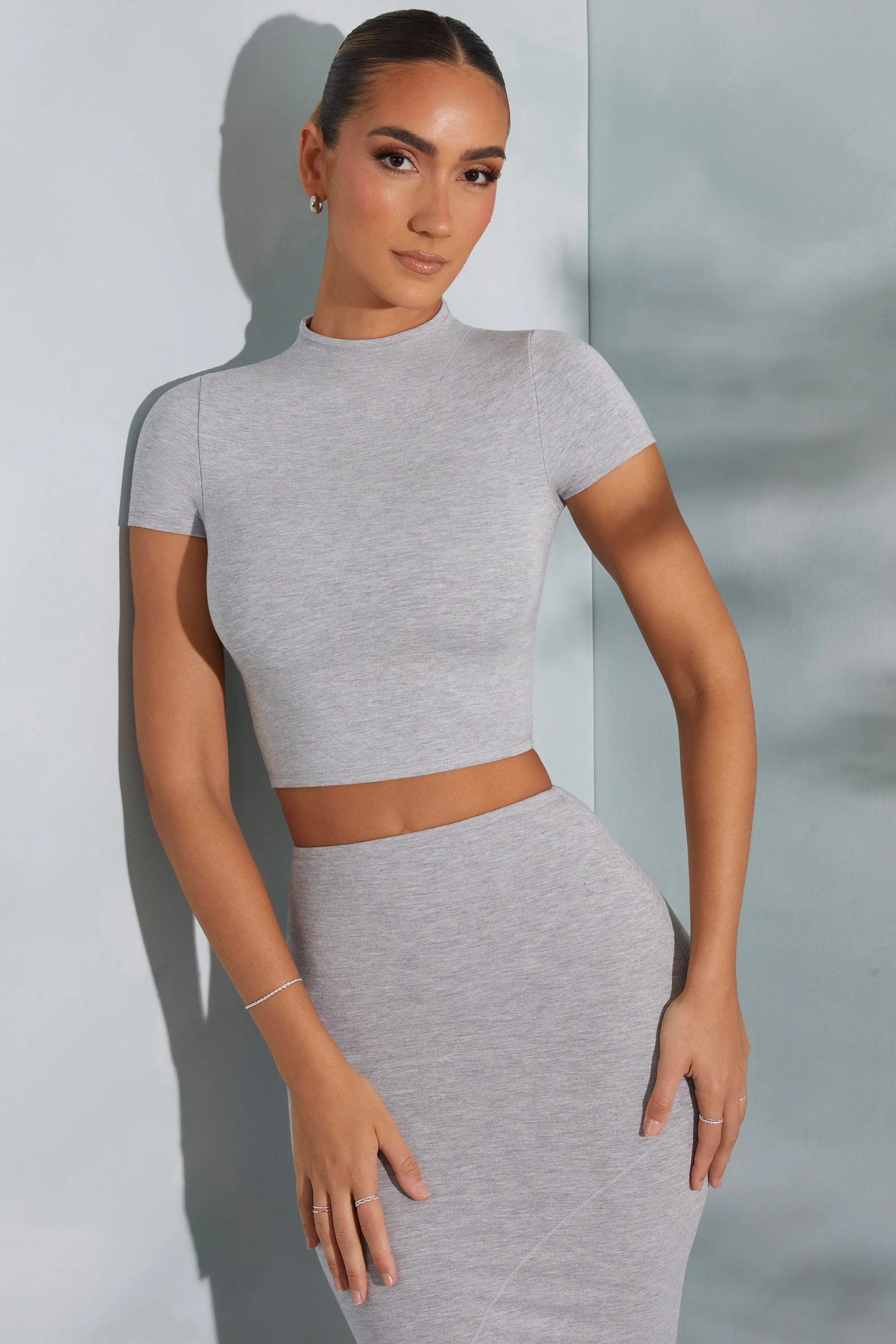 Contrast Stitch Turtleneck Crop Top in Marled Grey